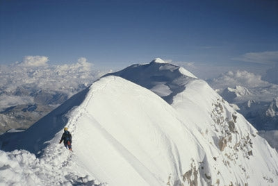 8000 metres - Route Photos - The breathtaking summit ridge of Shisha Pangma, looking to the main summit at 8046m. The tracks made by Jerzy Kukuczka and Artur Hajzer the day before are still in the snow for Steve (Untch) and me to follow to the summit.