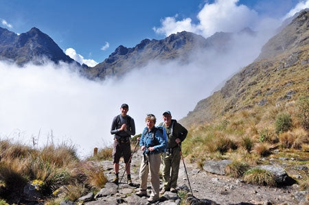 Hiking and Biking Peru's Inca Trails - Route Photos - Trekkers enjoying the sun on the pass