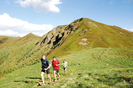 Walking in the Auvergne - Route Photos - Runners pass the Col de Cabre on the Puy de Peyre Arse horseshoe – travelling light!