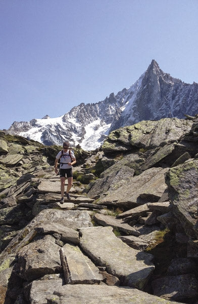 Trail Running - Chamonix and the Mont Blanc region - Route Photos - A runner framed by the distinctive profile of Les Drus (Route 1)