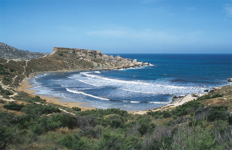 Walking on Malta - Route Photos - Ghajn Tuffieha Bay with the headland of Il-Karraba rising beyond