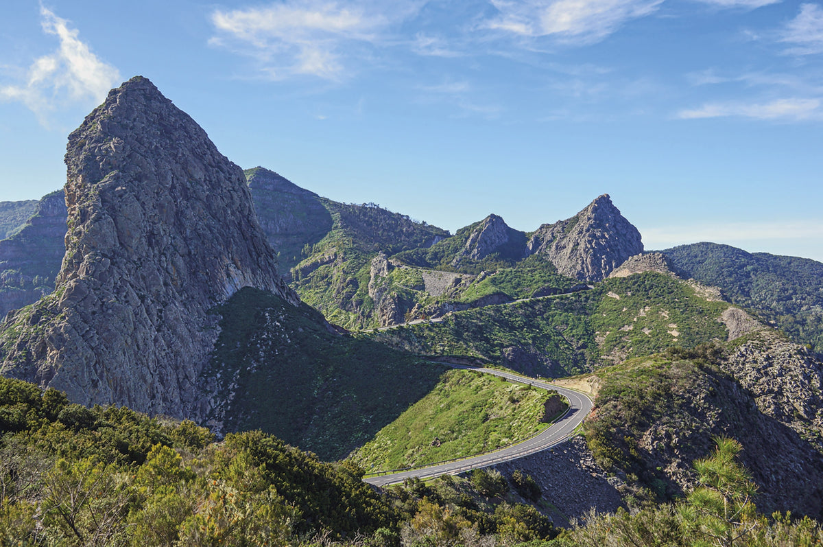 Walking on La Gomera and El Hierro - Route Photos - Looking back to the Roque de Agando after leaving a high-level road (La Gomera, Walk 2)