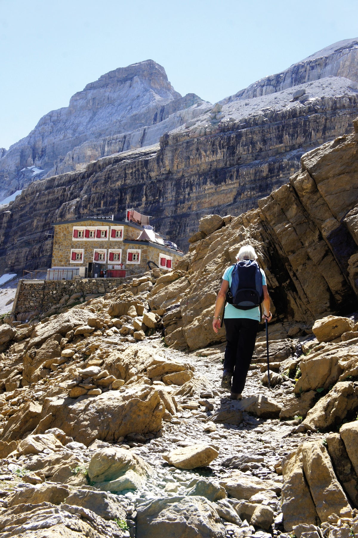 The Mountain Hut Book - Route Photos - The solid-looking Brèche de Roland refuge in the Cirque de Gavarnie (French Pyrenees)