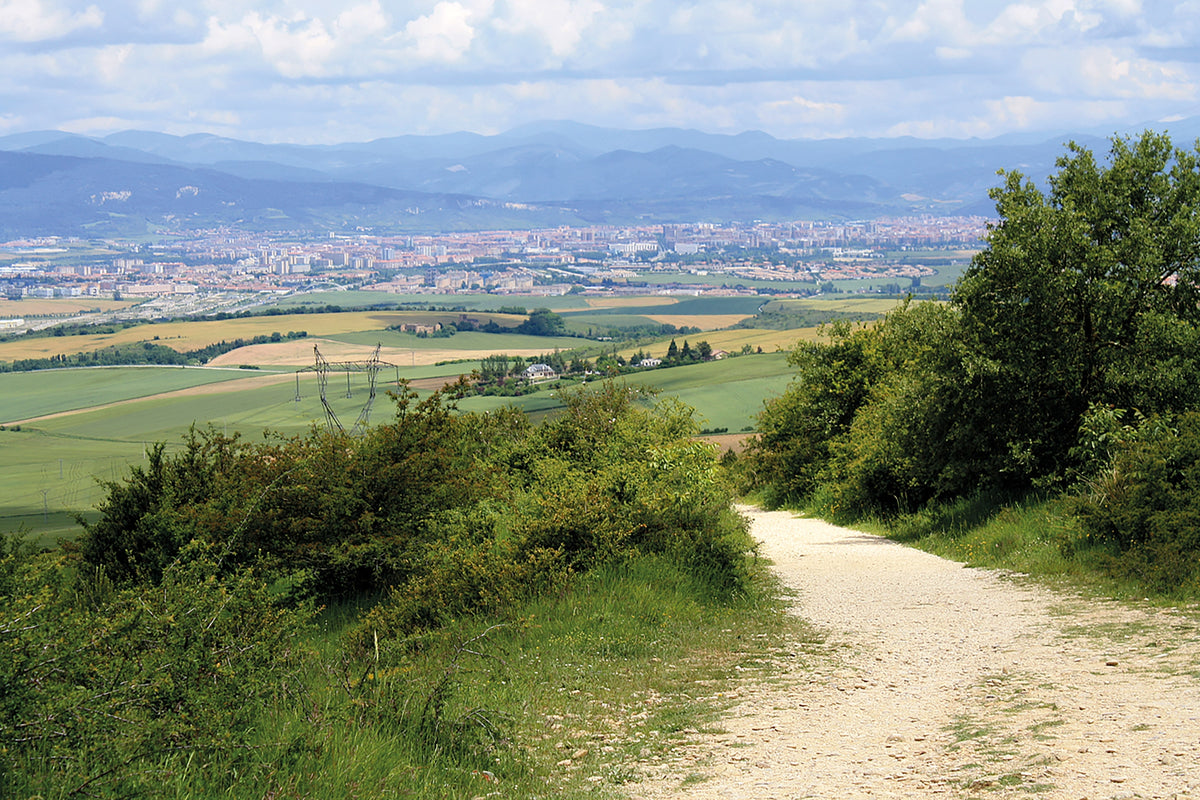 Cycling the Camino de Santiago - Route Photos - The steep track up to Alto del Perdón with Pamplona in the distance (Stage 3)