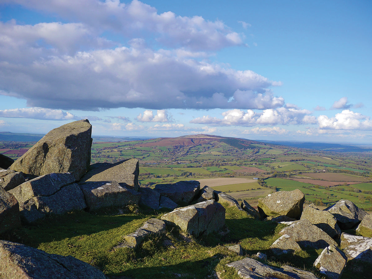 Walking the Shropshire Way - Route Photos - Giant’s Chair rocks on Titterstone Clee Hill, looking towards Brown Clee Hill (Stage 6)