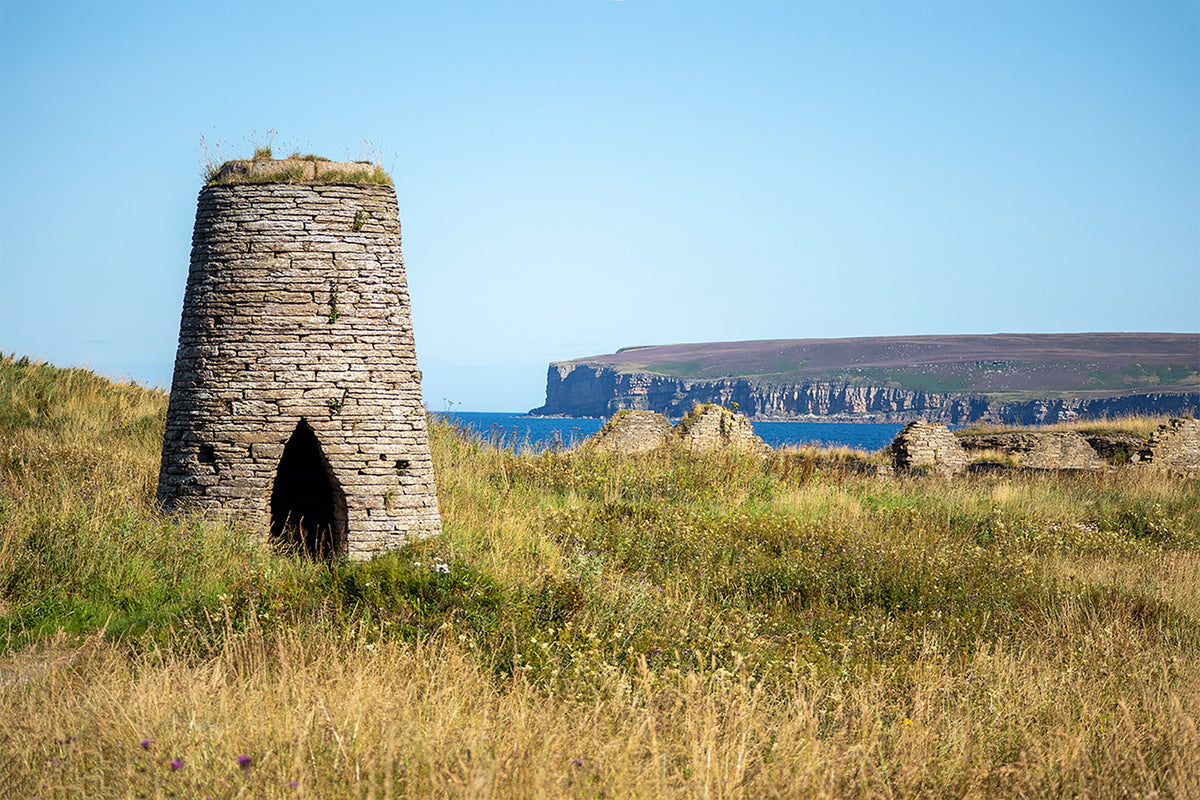 Cycling Land's End to John o' Groats - Route Photos - Remains of flagstone quarrying near the harbour at Castletown with the cliffs of Dunnet Head in the distance