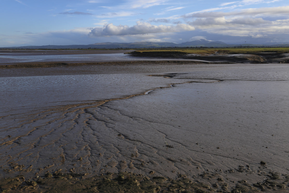 Walking the King Charles III England Coast Path: North West - Route Photos - Deep estuarine muds like these at Grune Point are often excluded from Coastal Access rights for good reason – don’t attempt to cross them (Stage 4)