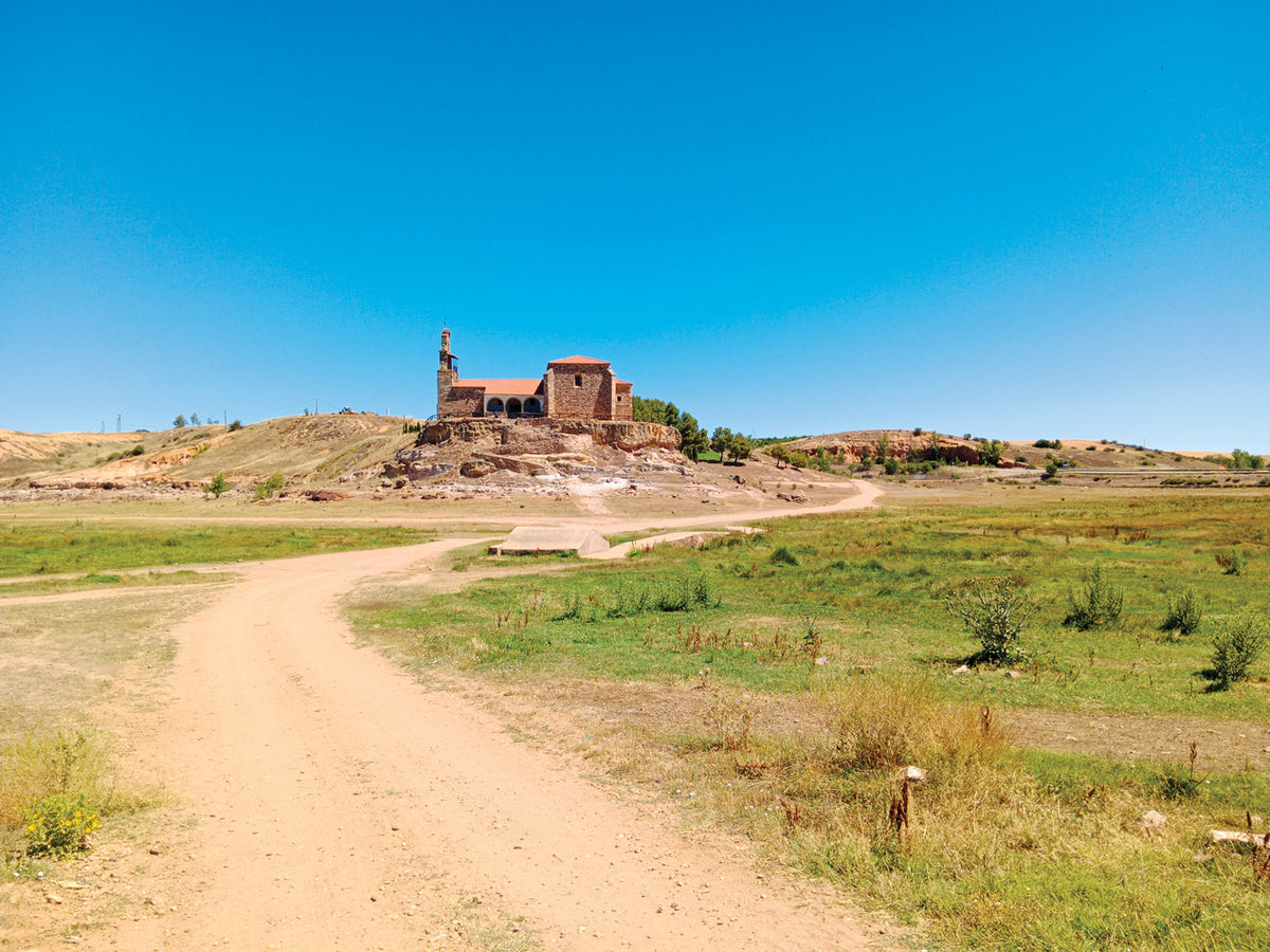 Walking La Via de la Plata and Camino Sanabres - Route Photos - Not a cloud in the sky as the Camino winds towards the Ermita de la Virgen del Castillo (Stage 27)