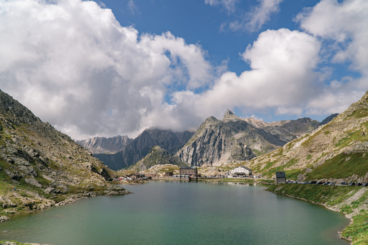 Walking the Via Francigena Pilgrim Route - Part 2 - Route Photos - Scattered buildings sit below the Tête de Fenêtre on the Italian side of the Great St Bernard Lake