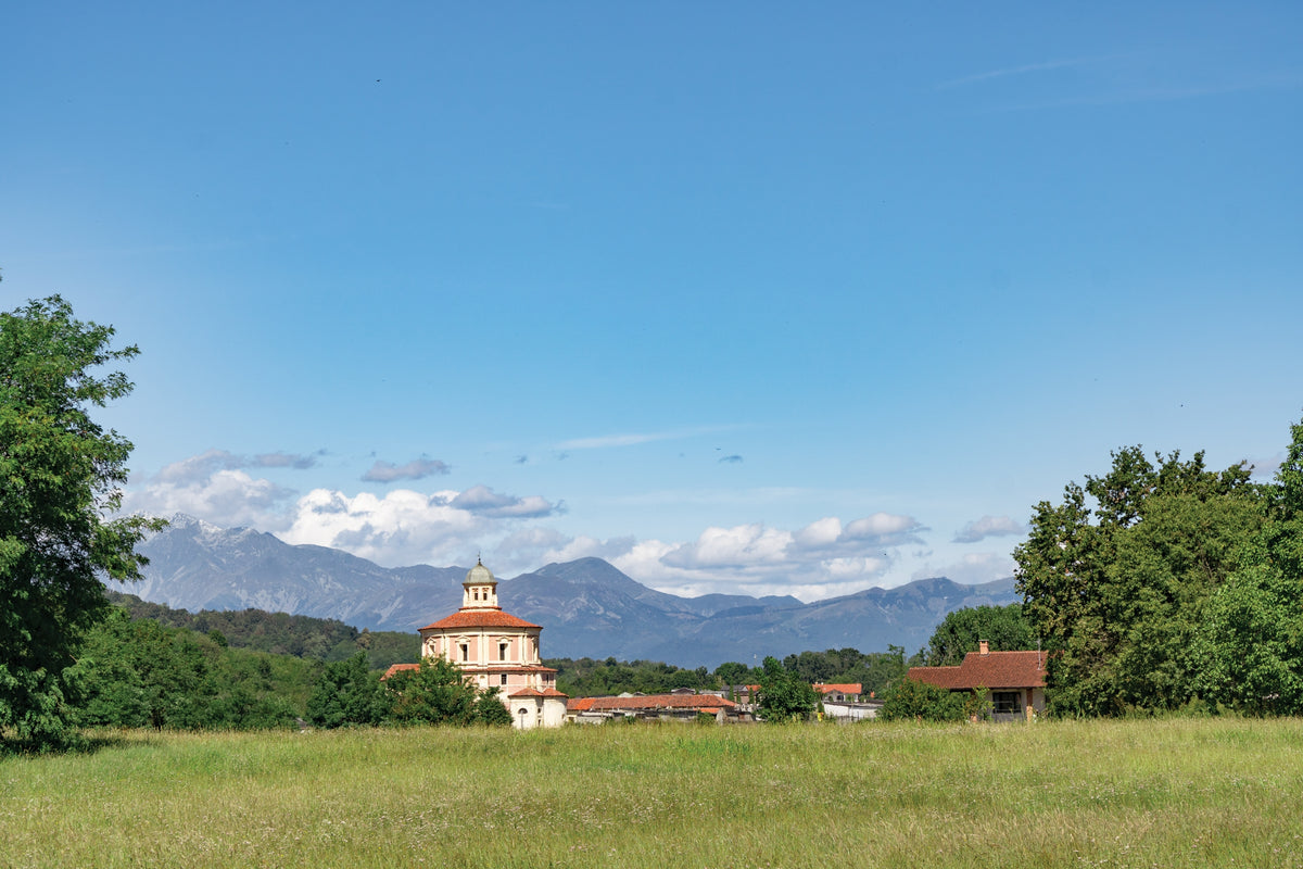 Walking the Via Francigena Pilgrim Route - Part 2 - Route Photos - The Church of Santa Maria di Babilone with the last peaks of the Alps in the distance