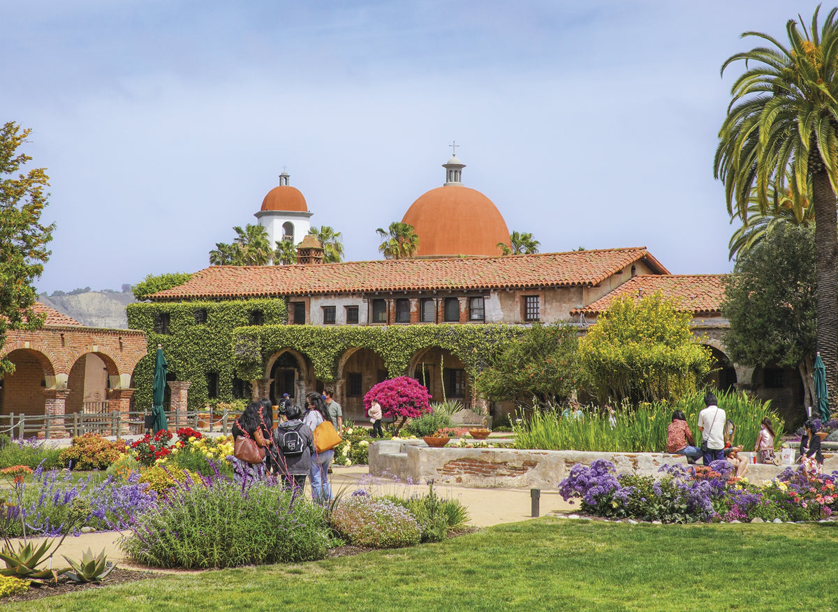 Hiking and Cycling the California Missions Trail - Route Photos - The dome and tower of the San Juan Capistrano Mission Basilica rise above the mission gardens (Stage 19)