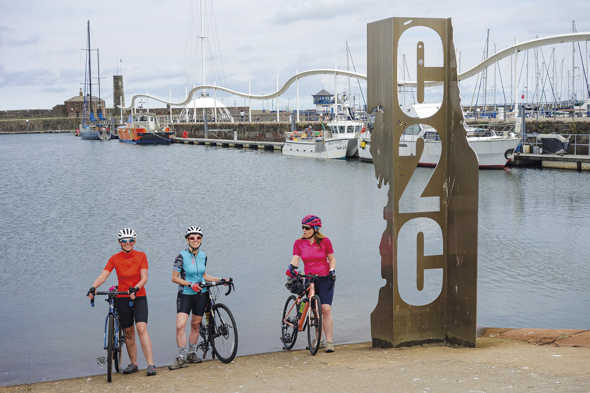 The Coast to Coast Cycle Route - Route Photos - Dipping the traditional wheel at the route’s Whitehaven start (Day 1)