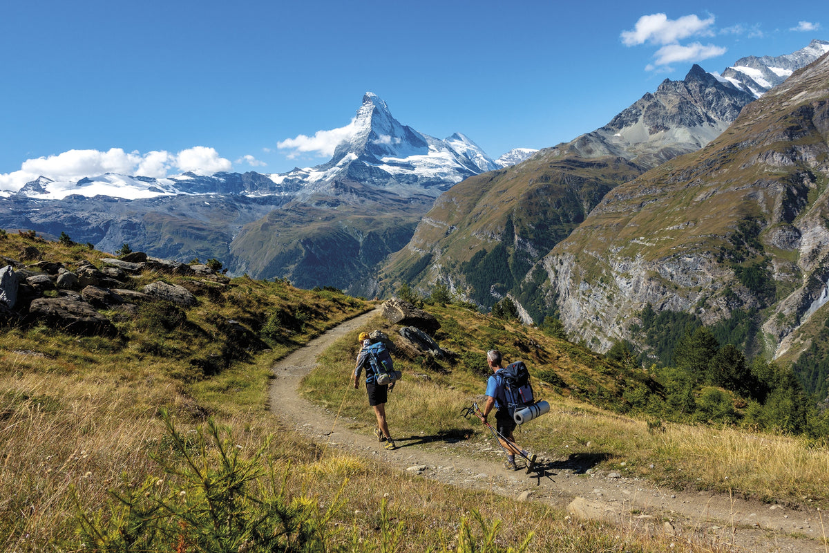 Trekking Chamonix to Zermatt - Route Photos - Trekkers on the last part of the Europaweg beginning the gradual descent in to Zermatt (Stage 14)