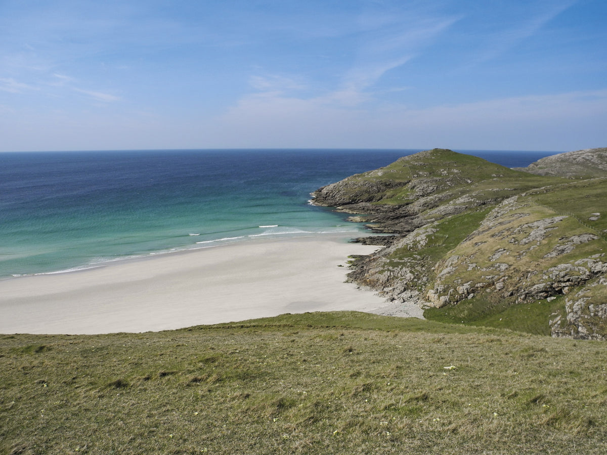 Walking on Uist and Barra - Route Photos - Dùn Sgùrabhal perched above the Atlantic