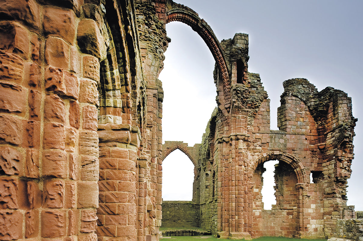 Walking St Cuthbert's Way - Route Photos - The ‘rainbow arch’ at the ruins of Lindisfarne Priory. This rib from the priory’s vault survived the collapse of the surrounding roof and tower above it (Stage 5)