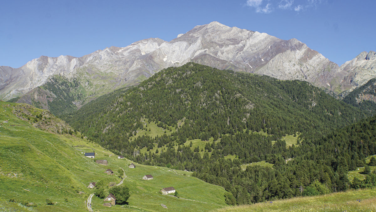 Trekking the GR11 Trail - Route Photos - The barns at Biadós with Pico Posets (3375m) behind (Stage 19)