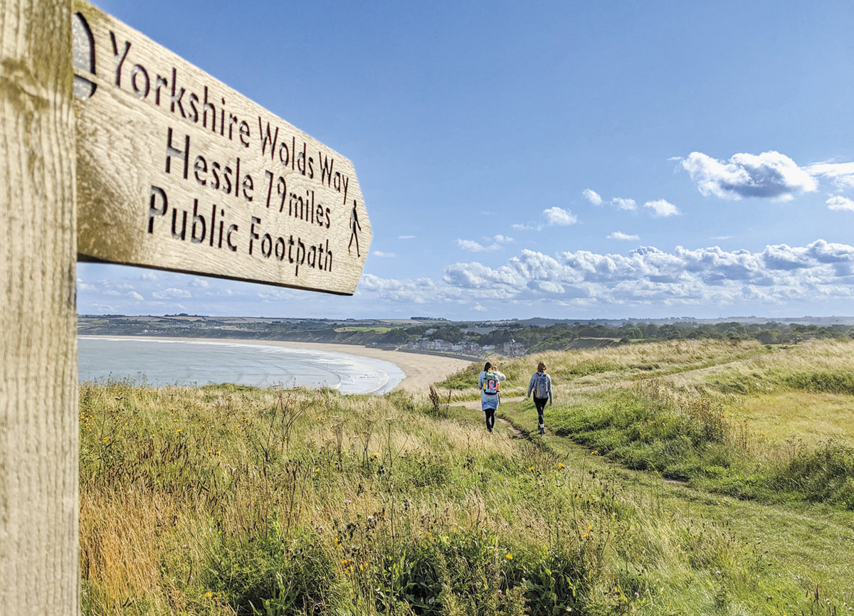 The Cleveland Way and the Yorkshire Wolds Way - Route Photos - A signpost at Filey Brigg points back to Hessle (YWW Stage 6)