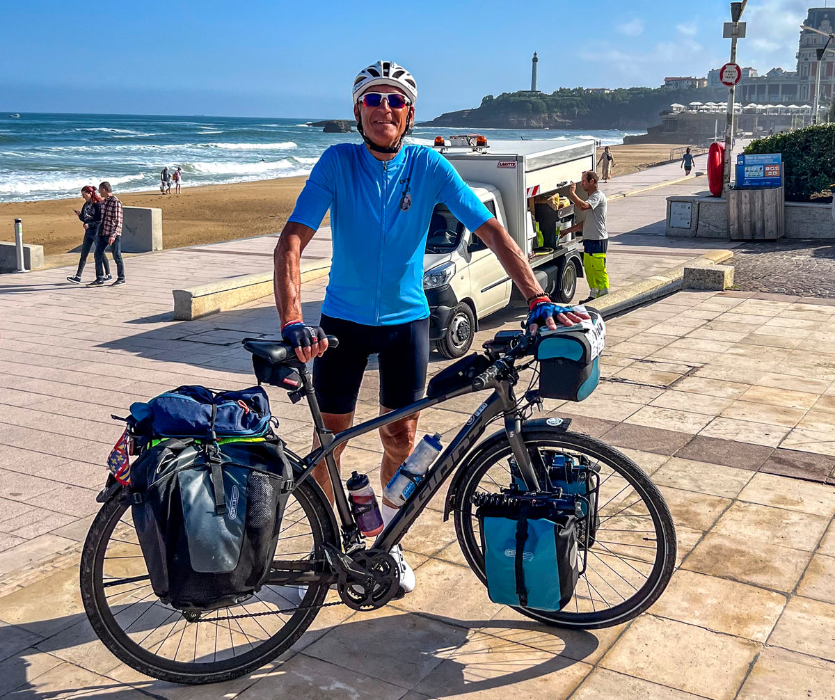 Cycling La Velodyssee - Route Photos - Cycle tourist with traditional front and rear pannier setup